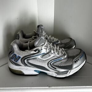 Womens New Balance 857 cross training shoes in white silver and blue accents